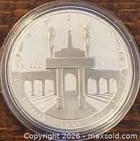 Obverse of 1984-S Olympic silver proof dollar in capsule