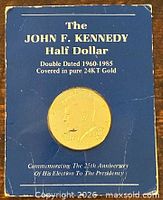 Front of display card showing obverse of gold-plated coin and text