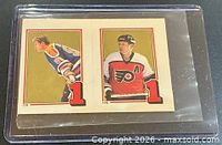 Front view showing images of Wayne Gretzky and Mark Howe with numeral 1 and numbers 174,176