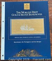 Presentation folder showing gold/silver banknote through window