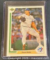 Front of the 1991 Upper Deck David Wells card in sleeve