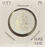 Reverse side showing Canadian Coat of Arms and 1997 date