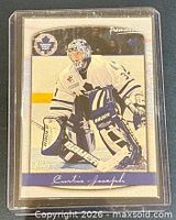 Front of 1999-00 Topps Premier Plus Curtis Joseph card in plastic holder
