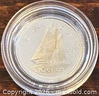 Reverse side showing Bluenose schooner and 10 CENTS legend
