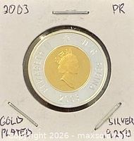 Obverse view of coin in 2×2 holder showing Queen Elizabeth II portrait, year 2003 and silver ring