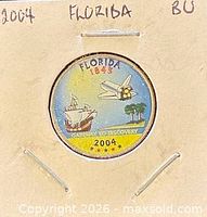 Obverse and reverse views of 2004 Florida colorized state quarter in 2×2 flip