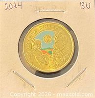 Reverse of colourized 2024 L.M. Montgomery commemorative loonie