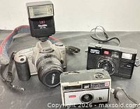 Group shot showing all three cameras and accessories