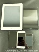 Group shot of two iPads and three iPhones