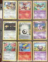 Front view of nine assorted Pokémon cards in binder sleeve