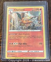 Front of Charizard holographic card showing artwork, stats and set number