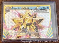 Front of Starmie BREAK card showing foil design, HP, set and card number
