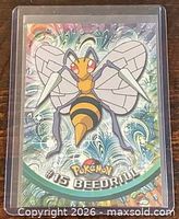 Front of #15 Beedrill Topps Pokémon TV Animation Edition card in sleeve