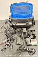 Overview of camcorder, bag, charger, remote, cables
