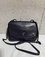 Front of black leather and suede Coach Faye crossbody with flap and chain strap