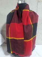 Scarf draped on mannequin showing pattern and fringe