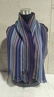 Scarf draped on mannequin showing full length and stripe pattern