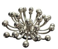 Angled view of stainless steel Pistillo-style light showing starburst arms