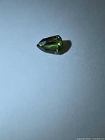 Fancy cut green sapphire angled view