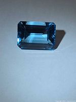 Front view of emerald-cut Swiss blue topaz