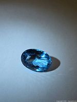 Top view of oval Swiss blue topaz showing rich blue color and facet pattern
