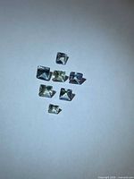 Seven square princess-cut multicolored Tanzanite stones
