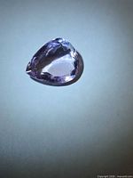 Pear-cut pink-purple amethyst front view under light