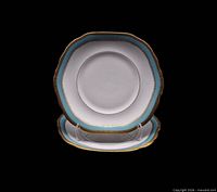 Front view of both matching serving plates on stand