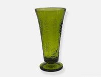 Full view of green pressed glass vase showing flared shape and footed base