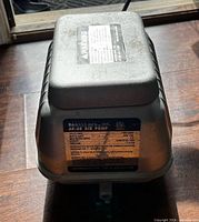 Top and side view of Danner AP-60 air pump showing housing and data plate