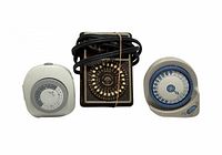 Front view of all three timers showing dials and overall condition