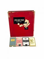 Po-Keno boxed game with four playing card decks displayed in front