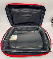 Open carrier showing clear rectangular glass casserole inside