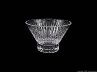 Full view of clear flared crystal bowl with vertical cuts