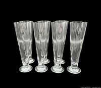 All seven crystal pilsner glasses grouped