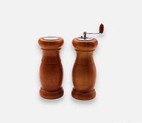 Front view of salt shaker and pepper mill standing upright
