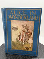 Front cover of blue cloth Windermere Series edition showing title and illustration