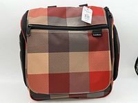 Front view showing plaid pattern, brand logo, and hang tag