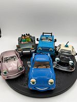 Front view showing all five Chevron Techron toy cars