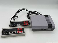 console and two controllers front view