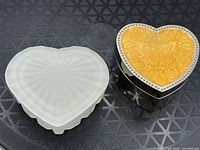 Top view of both heart-shaped trinket boxes closed