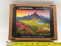 Front of Unidragon puzzle box showing artwork and specifications