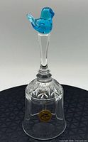 Front view of crystal bell highlighting cut pattern and Titan Art Glass label