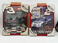 Front view of both framed NASCAR prints showing images and numbers
