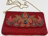 Front view showing floral beaded motif and chain