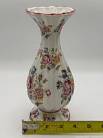 Full view showing vase front, measuring tape indicates height
