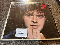 Front cover of David Essex Rock On LP in shrink wrap