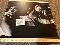 Front album cover showing title and artist