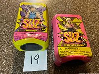 Front view of both sealed SBZ containers displaying characters Jesser and @BrittPlays