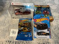 Group shot showing all sealed toy car packages and holiday car box